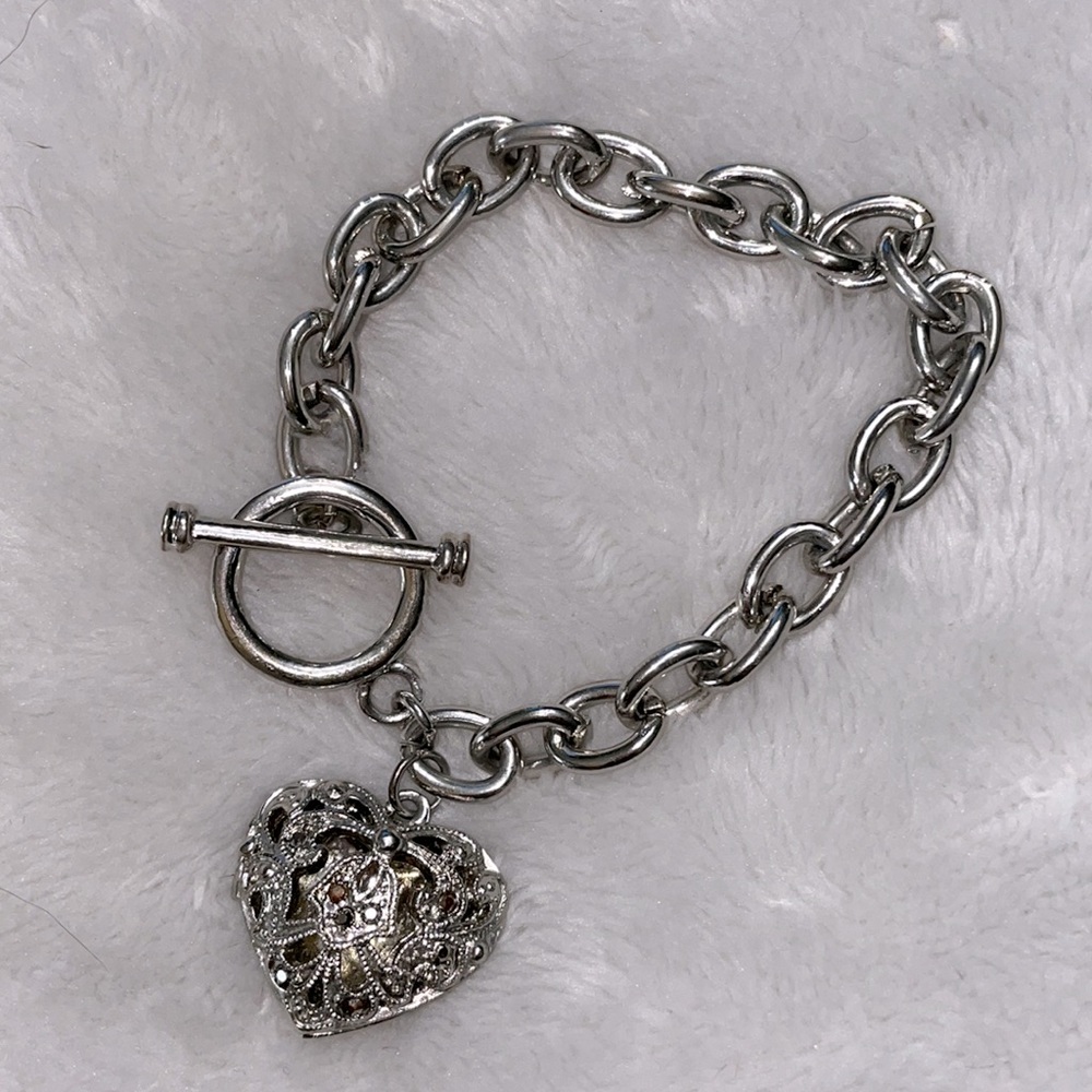 Silver Charm bracelet w/ locket.